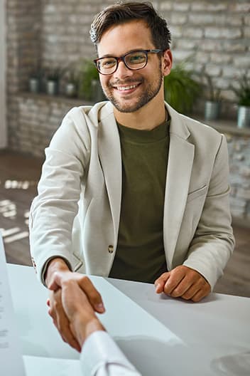 a man shaking hands with another